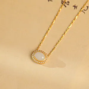 Elegant s925 silver necklace featuring a white jade pendant with a delicate pearl halo