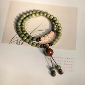 Green sandalwood Buddhist prayer beads bracelet with Boixing seeds for Zen ethnic style.