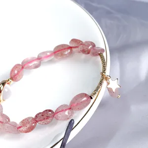 Handmade strawberry quartz beaded bracelet with a minimalist gold star charm pendant