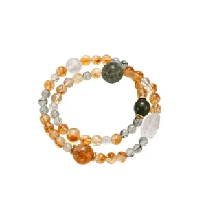 Pulsera de cuarzo rutilado natural amarillo y verde con dije Piyao de cristal tallado