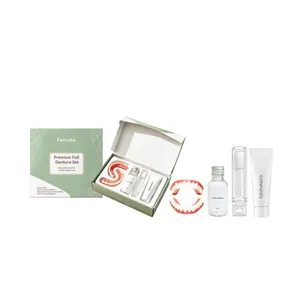 Feimuko complete denture kit with silicone teeth, adhesive, and toothpaste for dental care.