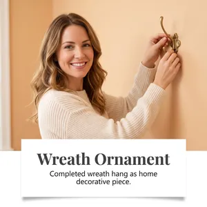 Vintage brass wall hook installed on a warm wall for hanging a DIY Christmas wreath