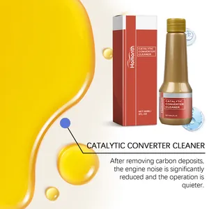 Detailed view of Homonth catalytic converter cleaner bottle with engine oil background