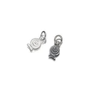Detailed macro shot of 925 sterling silver fish charms featuring antique distressed patterns