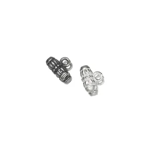 Close-up detail shot of antique silver bail beads DIY jewelry accessories findings.