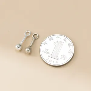 925 sterling silver matchstick charms shown next to a coin for size reference.