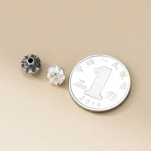 6mm 925 sterling silver retro saucer spacer beads shown next to a coin for scale