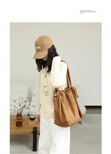 Japanese style casual brown suede-like drawstring tote bag for women shown with model
