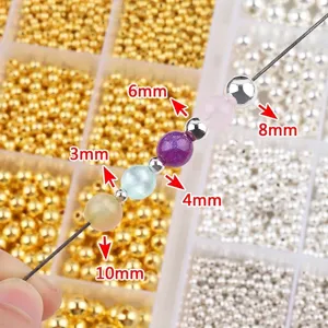 Sortierte goldene und silberne CCB-Abstandsperlen in 12-Gitter-Box für DIY-Schmuck