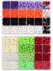 Detail of assorted colorful acrylic, skull and star beads in plastic organizer cases