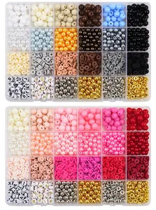 Detail of multi-colored acrylic and clay bead kit for DIY jewelry making in organizer boxes