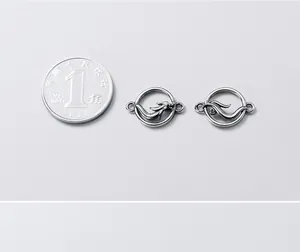 S925 silver dragon and phoenix charms shown next to a coin for size comparison