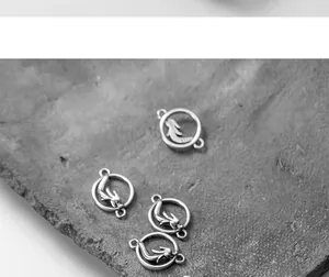 Macro detail of S925 sterling silver matte dragon pattern hollow jewelry connector