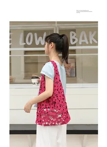 Vibrant pink hollow floral lace shoulder bag with drawstring inner pouch