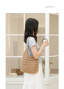 Handmade woven cotton thread shoulder bag with elegant hollow-out design shown on model side view