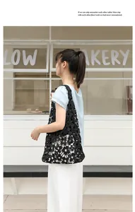 Black hollow floral lace shoulder bag styled with casual summer outfit outdoors
