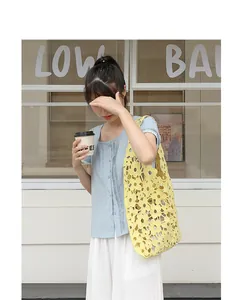 Floral hollow-out crochet shoulder bag for women in yellow with drawstring liner