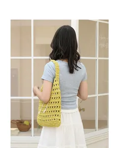 Handmade yellow crochet underarm bag with hollow design and drawstring for women
