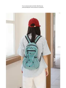 Back view of the casual Japanese style blue checkered nylon backpack worn by a model