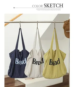 Trendy striped canvas tote bags with 'Bread' letter print in navy, cream, and yellow.