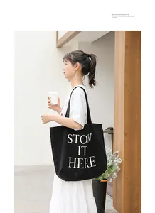 Borsa tote casual in tela nera con stampa 'STOW IT HERE' quotidiana
