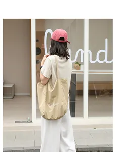Back view of a casual beige nylon tote bag featuring white Our Fav Party text detail