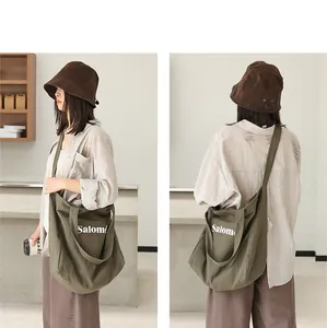 Model wearing the Japanese style army green canvas tote bag with Salomé letter print