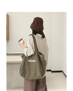 Stylish Japanese style olive green canvas tote bag with white Salomé letter print design