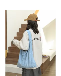 Light blue suede-like drawstring shoulder bag shown in a casual lifestyle setting