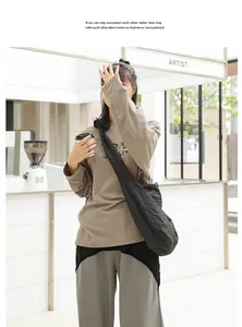 Casual Japanese style checkered messenger bag worn as a crossbody for everyday fashion.