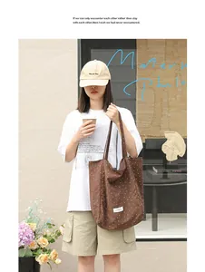 Casual brown nylon tote bag with white polka dots shown in a lifestyle outdoor setting