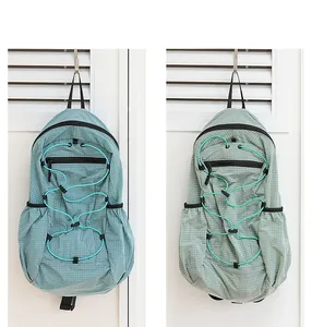 Detailed view of Japanese style casual grid nylon backpacks in blue and green with drawstrings