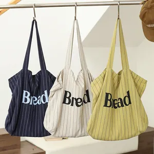 Stylish striped cotton canvas tote bag featuring Bread letter print in three trendy colors