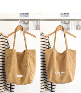 Japanese style nylon tote bags featuring polka dot patterns and letter print details