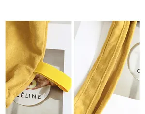 Close-up of yellow suede tote bag showing stitching and elastic strap details