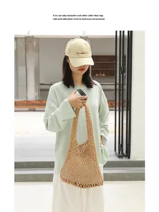 Detail of a handmade beige cotton woven mesh shoulder bag for casual summer style