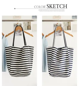 Detailed side-by-side view of striped canvas tote bags in black and navy options