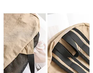 Primer plano de la tela de nailon caqui y el bolsillo de malla negra en la mochila casual