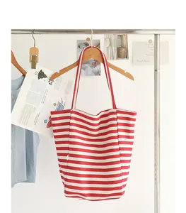 Large capacity red and white striped canvas tote bag hanging on a stylish wooden hanger