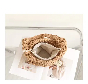 Detailed top view of the hollow hand-woven cotton rope bag with a drawstring inner pouch.