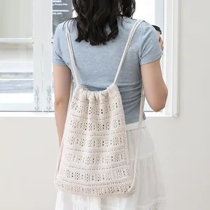 Mochila casual de algodón tejida con cordón y diseño calado para mujer