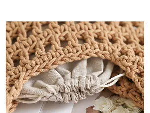 Close-up detail of a minimalist hand-woven cotton thread underarm bag with inner pouch