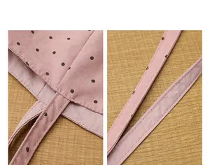Close-up of durable stitching and polka dot pattern on pink nylon tote bag