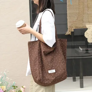 Brown polka dot canvas tote bag with artistic Japanese style for women's daily use.