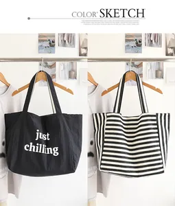 Close-up of casual striped nylon tote bag and black tote with just chilling text