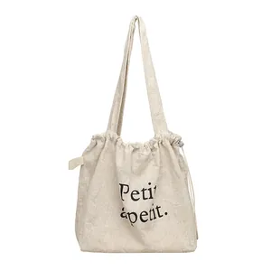 Bolso tote informal de algodón y lino con cordón e impreso de letras Petit appétit