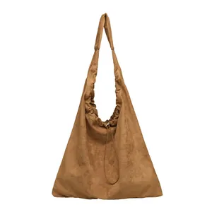 Elegant brown suede hobo shoulder bag featuring stylish drawstring and pleated details