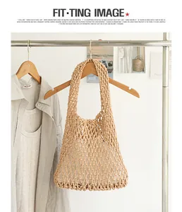 Detailed view of handmade woven cotton mesh underarm bag with inner drawstring pouch
