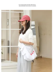 Minimalist Japanese style white nylon crossbody bag with red LOVE lettering detail