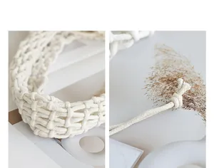 Close-up detail of hand-woven cotton thread mesh bag showing texture and knot